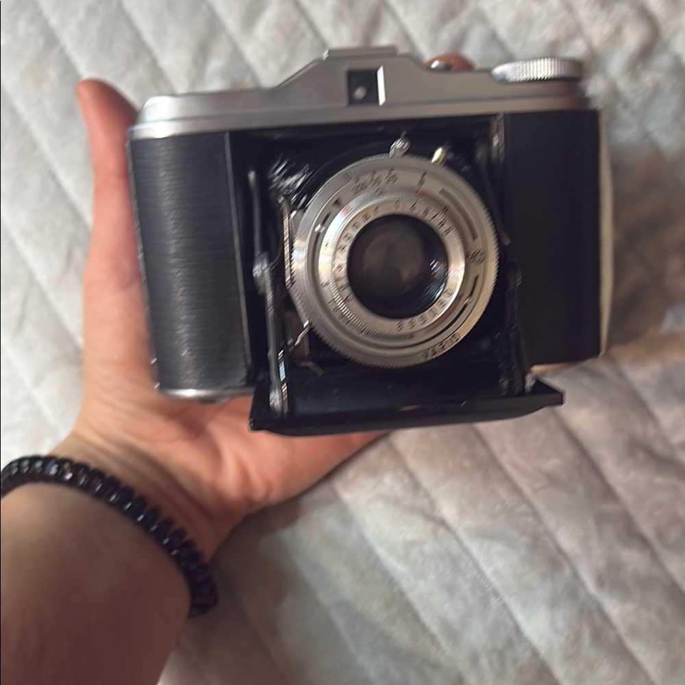 Vintage Black and Silver Film Camera with Collapsible Lens